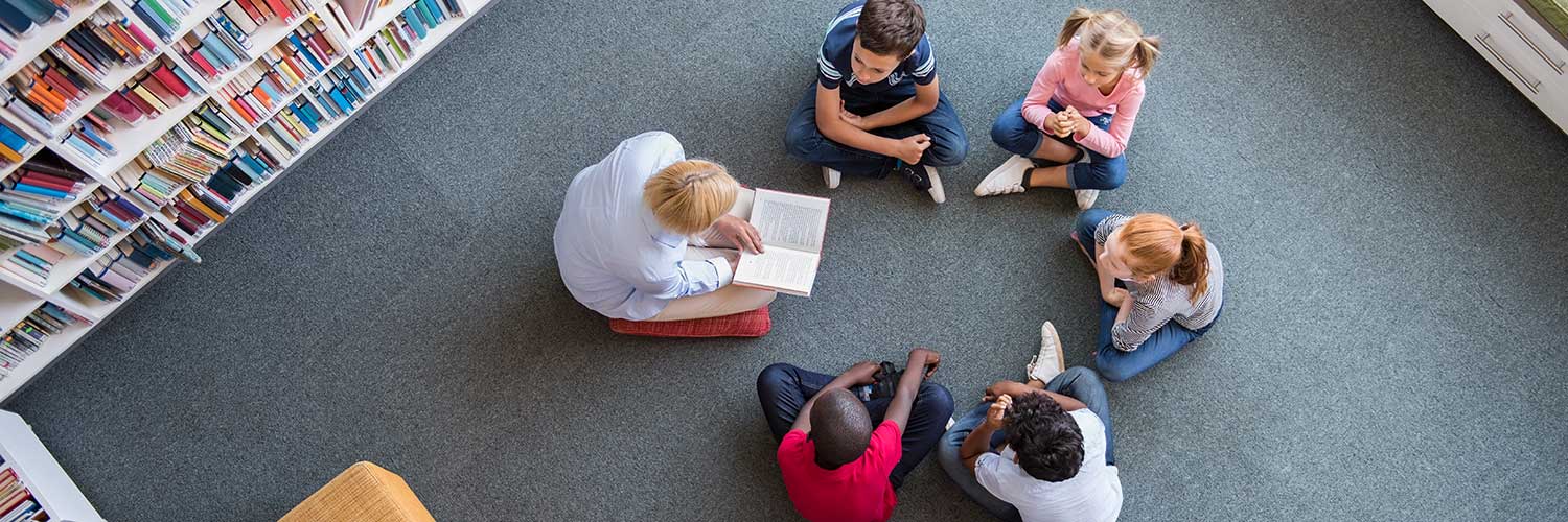School librarian talking to students